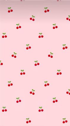 a pink background with cherries on it