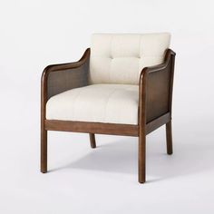 the chair is made out of wood and has a white upholstered fabric on it