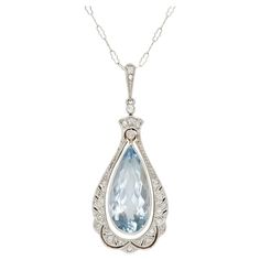 Finley crafted in 14k white gold with a Pear-Shaped Aquamarine weighing approximately 7.00 carats. The pendant features diamonds weighing approximately a total of 0.40 carats. Edwardian, circa 1910s Formal Pear-shaped Diamond Necklace, Timeless Teardrop Diamond Necklace For Formal Occasions, Art Deco White Gold Necklace With Gemstone, White Gold Art Deco Gemstone Necklace, Art Deco White Gold Gemstone Necklace, Exquisite Drop Diamond Necklace For Formal Occasions, Exquisite Diamond Drop Necklace For Formal Occasions, Platinum Diamond Gemstone Necklace For Wedding, Wedding Platinum Diamond Necklace With Gemstone