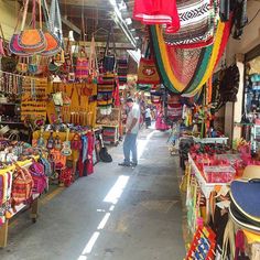 a man is walking through an open market