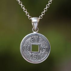 Designed by Balinese artisan Dewa Arimbawa the pendant of this necklace resembles a traditional Indonesian aksara coin. The classic coin is crafted from sterling silver featuring Indonesian characters that surround a square hole in the center. Bali Silver, Children Clothes, Domed Ring, Sterling Silver Necklace Pendants, Balinese, Contemporary Jewelry, Jewelry Packaging, Silver Pendant Necklace, Jewelry Gift Box