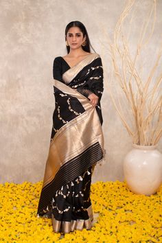 Expertly crafted with pure Katan silk, this black Banarasi saree features intricate Kaduwa sona rupa motifs. The traditional design and luxurious fabric make it a versatile addition to any wardrobe. Elevate your style with this exquisite and timeless piece. Black Art Silk Pre-draped Saree With Zari Weaving, Festive Black Pre-draped Saree With Cutdana, Designer Black Banarasi Silk Saree, Traditional Black Pre-draped Saree, Black Pre-draped Saree With Traditional Patterns, Black Pre-draped Saree With Pallu For Festive Occasions, Festive Black Pre-draped Saree With Self Design, Traditional Black Chanderi Saree, Black Bollywood Handloom Pre-draped Saree