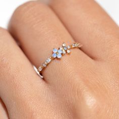 Take beauty wherever you go in the Blue Blossom Garden Ring. This design has become a GC favorite and is here to stay! You'll get lost in the stunning and calming baby blue and milky white cubic zirconia stones. Beautiful Earth Boutique, Cute Trendy Jewelry, Simplistic Rings, Cute Aesthetic Jewelry, Botanical Rings, Pretty Rings Simple, Baby Blue Jewelry, Wildflower Jewelry, Wedding Ring Flower