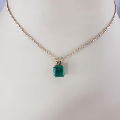 14K Yellow Gold Emerald Pendant JAGi Certified  This stunning pendant features one emerald cut natural emerald (8.6 mm x 7.5 mm) set in classic 14K yellow gold.  Emerald weight: 2.02 ct.  Size: 14 mm x 7.5 mm  Stamped: 14K  Weight:  0.8 dwt./ 1.25 gr.  JAGi Certificate included.  *Chain not included.  Very good condition, professionally polished.  Will come packaged in a gift box or pouch (when possible) and will be shipped U.S. Priority Mail Insured. Classic Emerald Cut Emerald Necklace With Prong Setting, Classic Emerald Cut Necklace With Prong Setting, Formal Emerald Cut Emerald Necklace, Classic Emerald Cut Emerald Necklace For May Birthstone, Classic Yellow Gold Emerald Cut Necklace, Gold Emerald Cut Emerald Necklace, Classic 14k Gold Emerald Cut Emerald Necklace, Yellow Gold Emerald Cut Emerald Necklace, Green Emerald Cut Necklace With Prong Setting