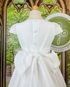 Beautiful first communion dress, made with natural white linen. The dress has minimalistic pleats and delicate floral laces. It has buttons on the back for closure, and strings to form a bow. Made in Spain Dry Clean Final sale, no exchanges nor returns will be processed after purchase Classic First Communion Dress With Ruffles, Spring First Communion Dress With Bow, Vintage Cotton Dress For First Communion, First Communion Princess Dress With Bow, First Communion Cotton Dress With Ruffles, Holy Communion Dresses, First Communion Dress, First Communion Dresses, Spanish Fashion