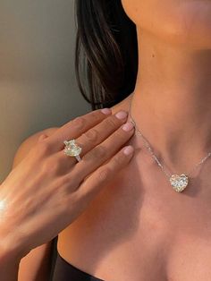 Upto 90% off on stone, Just pay for silver and cast. Make a statement with this luxurious heart cut lab diamond jewelry set. The set includes a stunning engagement ring, wedding band, and matching necklace, all featuring heart cut lab diamonds in a 6 carat. The diamonds are set in high-quality 925 sterling silver, giving the set a timeless and elegant look. The necklace is beautifully crafted to complement the ring and band, making this set perfect for any special occasion, such as weddings, par Diamond Necklace Wedding, Heart Shaped Engagement Rings, Diamond Jewelry Set, Wedding Ring Necklaces, Silver Party, Rings Necklace, Ring Wedding Band, Silver Jewellery Sets, Classy Jewelry