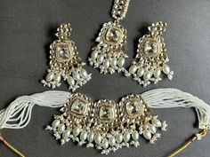 White and gold polki choker set Heavy Kundan Jewelry For Eid, White Necklaces For Diwali Party, White Bollywood Style Jewelry Gift, White Bridal Necklace For Diwali Party, Round Kundan Jewelry For Eid, Bollywood Kundan Jewelry For Eid, Round Jewelry For Eid Weddings, Kundan Jewelry For Eid, White Kundan Festive Jewelry