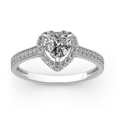 a heart shaped diamond ring with pave set shoulders