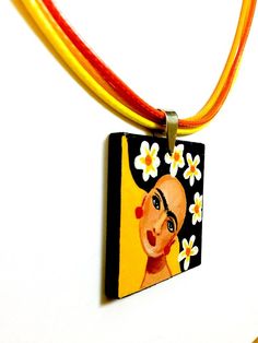 Frida Kahlo Pendant - Frida Kahlo Accessories (Original Artwork). 100% Hand Painted Frida Necklace. Made from scratch. Original artwork. No prints. We put our heart and soul into making something really special for our shop at Fridamaniacs. We wanted to create something very unique. Something you won't find everywhere else on Etsy or other places. Every single piece is unique in the whole universe!!! This gorgeous hand painted Frida Kahlo pendant is a beautiful mini masterpiece. Original Artwork Artistic Festival Jewelry, Artistic Necklaces With Unique Variations, Multicolor Hand Painted Jewelry For Festivals, Multicolor Artistic Necklace For Gifts, Artsy Pendant Jewelry For Festival, Multicolor Artistic Design Necklace For Gift, Hand Painted Yellow Jewelry For Gift, Artsy Festival Pendant Jewelry, Hand Painted Jewelry For Festival