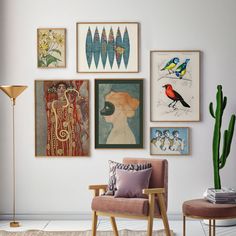 a living room filled with lots of pictures and furniture next to a tall cactus plant