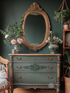 there is a dresser with flowers on it