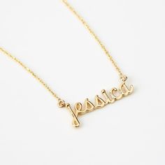 Script Name 14K Gold Necklace Adorn yourself with this 14K Gold Script Name Necklace, a perfect blend of personalization and style. Customizable for women, it's more than just a piece of jewelry; it's a statement of identity. This dainty 14k yellow gold necklace, makes an excellent personalized gift, elevating your elegance and charm. With its timeless design, it's a valuable addition to your jewelry collection, enhancing your style and personality. You'll have: 14k solid gold handcrafted neckla Formal Yellow Gold Name Necklace With Initial Pendant, 14k Gold Initial Pendant Name Necklace For Anniversary, Formal 14k Gold Name Necklace With Initial Pendant, 14k Gold Initial Pendant Name Necklace For Formal Occasions, Customizable 14k Gold Anniversary Necklaces, Delicate 14k Gold Engraved Charm Necklace, Classic 14k Gold Custom Necklace, Minimalist Sterling Silver Name Necklace For Formal Occasions, Customizable 14k Rose Gold Jewelry