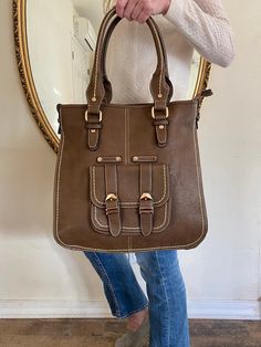 "Large Faux leather purse, bag, shoulder bag, tan, brown, Tooled, Tote Nice Large all faux leather bag with beige stitching Lined interior with zippered pocket and 2 slip pockets Front has one large snap close pocket Zip to close Please see measurements: 14\" X 13\" X 5\" 8\" drop Double straps Excellent condition, unused NK532DR Large Faux leather purse, bag, shoulder bag, brown, Tote" Leather Shopper Bag, Everyday Tote Bag, Faux Leather Purse, Shoulder Bag Brown, Faux Leather Bag, Brown Leather Totes, Large Leather Tote, Brown Tote, Brown Leather Shoulder Bag