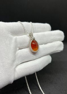 This carnelian necklace encapsulates a timeless look that is sophisticated, elegant, and bright.  Carnelian is believed to promote leadership, ambition, and creativity. Since ancient times, this gemstone has been treasured by many different cultures. Some believe it to be encouraging, inspiring, and vibrant in its energy. Claim this charm for yourself or for someone you love! FREE SHIPPING ON ALL USA ORDERS SHIPPING FROM PHOENIX, AZ @gcgjewelers Oval Cabochon Agate Jewelry For Gifts, Orange Oval Necklace For Gift, Classic Orange Necklace For Gifts, Classic Orange Necklace For Gift, Elegant Carnelian Necklace With Polished Finish, Amber Necklace With Polished Finish For Anniversary, Orange Round Pendant Jewelry For Formal Occasions, Luxury Carnelian Jewelry For Formal Occasions, Elegant Orange Necklace With Polished Finish