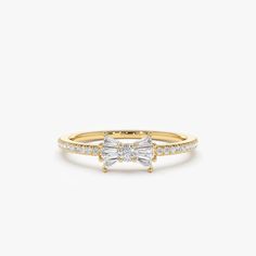 "Diamond Ring / Bow Ring / 14k Gold Baguette and Round Diamond Bow Ring / Dainty Bow Ring / Dainty Ring / Promise Ring by Ferkos Fine Jewelry Ferko's Fine Jewelry * Made to Order * Gold Kt: 14K (also available in 18K) * Available Gold Color: Rose Gold, Yellow Gold, White Gold * Round Diamonds: 22 pcs 1.0 MM * Round Diamonds: 1 pcs 2.0 MM * Baguette Diamonds: 6 pcs 2.5 x 1.4 - 2.5 x 1.3 MM * Diamond Carat Weight: 0.25 ctw * Diamond Color-Clarity: G Color VS/SI Clarity If you have any additional q Gold Baguette Cut Ring With Halo Setting, Gold Rings With Halo Setting In Baguette Cut, Yellow Gold Baguette Cut Halo Ring, White Gold Promise Ring With Baguette Diamonds, Fine Jewelry Promise Ring With Baguette Diamonds, Gold Baguette Cut Cluster Promise Ring, Dainty White Gold Ring With Baguette Diamonds, Gold Baguette Cut Diamond Ring With Halo Design, Gold Baguette Cut Rings With Halo Design