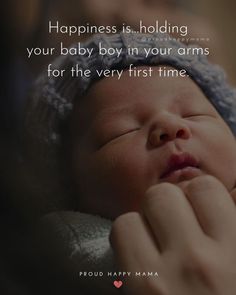 a woman holding a baby in her arms with the caption happiness is holding your baby boy in your arms for the very first time