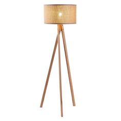 a wooden floor lamp with a beige shade