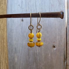 I have been seeing mustard yellow all over lately. I have had these beads tucked away, just waiting for inspiration. These earrings are dangling from pure titanium post ear wire. Perfect for those with sensitive ears. The Czech bead is a 6mm melon bead. It has a touch of black in various places on the bead. Very vintage feel to the beads. These earrings are a perfect match to the necklace that is also listed. You can find it here. https://www.etsy.com/listing/707647612/vintage-style-mustard-yell Yellow Beaded Czech Glass Earrings, Yellow Beaded Earrings With Czech Glass, Yellow Beaded Earrings In Czech Glass, Hypoallergenic Gold Bohemian Beaded Earrings, Nickel-free Yellow Czech Glass Earrings, Nickel Free Yellow Czech Glass Earrings, Yellow Beaded Earrings For Pierced Ears As Gift, Yellow Czech Glass Beaded Dangle Earrings, Adjustable Yellow Beaded Earrings