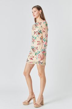 This stylish mini dress features an eye-catching floral embroidery a flattering fitted silhouette and long sleeves for a sophisticated feminine look. Perfect for special occasions and elegant evenings out. Floral embroidery Mini length Fitted Long sleeves Round neckline Pom Pom trims Back zipper Lining Hand wash cold Do not bleach Do not tumble dry Iron low Shell: 100% Polyester Contrast: 100% Nylon Lining: 95% Polyester 5% Spandex Exclusive of Decoration HN1773D Total length: 34.5 " Bust: 34" X Long Sleeve Bodycon Dress For Brunch, Bodycon Long Sleeve Dress For Brunch, Spring Fitted Long Sleeve Mini Dress, Fitted Long Sleeve Mini Dress For Spring, Spring Embroidered Sequin Dress For Party, Spring Sequined Embroidered Dress For Party, Spring Party Embroidered Dress With Sequins, Chic Embroidered Dress With Floral Design For Evening, Chic Floral Embroidered Evening Dress