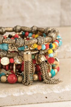 Elegant bohemian-inspired stretch bracelet featuring multi-layered, colorful mixed wood, stone, and metal beads. The combination of textures and hues gives this bracelet a unique and eye-catching look. Made with acrylic, wood beads, and zinc, this bracelet is also nickel/lead compliant for added safety. Measuring approximately 9.25 inches in length and 2.5 inches in diameter, this bracelet will add a touch of boho-chic to any outfit. Imported for the highest quality. Wood Beads Jewelry, Classy Yet Trendy, Memorial Bracelet, Inspirational Bracelets, Bohemian Bracelets, Wood Stone, Layered Bracelets, Jasper Beads, Lovely Jewellery