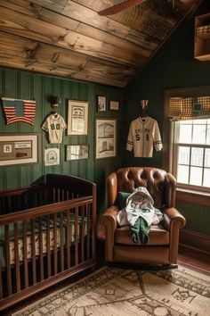 a baby's room with an old fashioned crib and football memorabilia on the wall