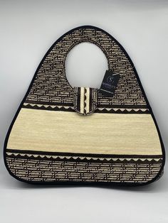 These beautiful handbags are made from Cana Flecha which is an indigenous palm fiber found in the northern territory of Colombia. They are beautifully hand crafted by the people from the Zenu tribes in Colombia. These handbags are colorful with vibrant colors, which is a pure reflection on the region and the warmness of these master artisans that work in this industry every day. Top Handle Woven Jute Shoulder Bag, Woven Jute Shoulder Bag With Top Handle, Jute Woven Top Handle Shoulder Bag, Top Handle Jute Shoulder Bag With Woven Details, Traditional Satchel Beach Bag, Traditional Satchel Bag For Beach, Top Handle Natural Jute Shoulder Bag, Natural Woven Top Handle Shoulder Bag, Natural Jute Top Handle Shoulder Bag