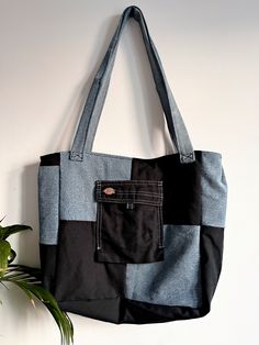 a black and grey bag hanging on the wall