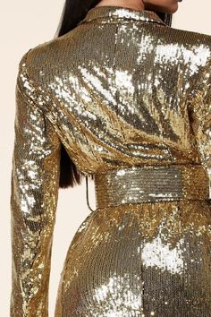 𝑫𝒆𝒔𝒄𝒓𝒊𝒑𝒕𝒊𝒐𝒏: Gold Sequins Mini Dress features a collared neckline and long sleeves with button cuffs. A relaxed bodice with two buttoning top flap pockets falls to a banded waist, atop a mini A-line skirt with oversized utility-inspired pockets. An exposed, function Model wearing size Small 𝑺𝒊𝒛𝒆 𝑪𝒉𝒂𝒓𝒕: • 2-4 Small • 6-8 Medium • 10-12 Large 𝑺𝒉𝒊𝒑𝒑𝒊𝒏𝒈 • This Item ships for free. 𝑹𝒆𝒕𝒖𝒓𝒏𝒔 • Returns (For store credit only) accepted within 30 days after your package Gold Long Sleeve Mini Dress For Fall, Gold Mini Dress For Fall, Winter Party Mini Dress With Button-up Front, Gold Long Sleeve Winter Dress, Gold Long Sleeve Dress For Winter, Long Sleeve Party Dress With Button Closure, Long Sleeve Mini Dress For Party Season, Fall Party Mini Dress With Button Closure, Glamorous Gold Long Sleeve Mini Dress