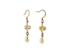 These topaz crystal earrings also feature dangling white freshwater pearls with your choice of gold-plated regular, nickel free or 22K gold-plated hypoallergenic fishhook ear wires.  Perfect for casual or formal wear, they make a lovely handmade gift for women that adds a touch of sparkle. The beaded earrings dangle 1-3/4 inches from the top of the ear wires to the bottom of the freshwater pearls.   All gold is gold plated except for the 22K gold-plated hypoallergenic ear wires. ★ ★ ★ ★ ★ ★ ★ ★ ★ ★ ★ ★ ★ ★ ★ ★ ★ ★  Customize Your Order CUSTOMIZE GOLD EAR WIRES:  Click on the "Material" drop-down box on the right column of this page for choice of fishhook ear wires--nickel free earrings (shown in images), 22K surgical-steel hypoallergenic earrings or regular earrings (for those not sensitiv Gold Crystal Earrings With Pearl Charm, Gold Pearl Crystal Earrings For Gift, Earrings For Sensitive Ears, Crystal Pearl Earrings, Topaz Crystal, Surgical Steel Earrings, Nickel Free Earrings, Freshwater Pearls Earrings, White Freshwater Pearl