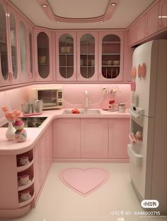 a pink kitchen with lots of cupboards and counter space, including a heart shaped rug on the floor