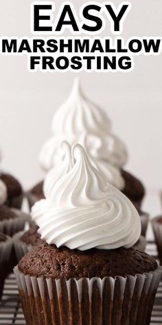 chocolate cupcakes with white frosting on top and the words easy marshmallow frosting