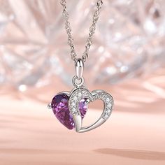 A sparkling tribute to you, this heart necklace is a special look you are certain to adore. Crafted in sterling silver, it features a shimmering purple heart-shaped stone with an open heart-shaped frame. Smaller stones adorns heart frame, adding subtle sparkle. It's a sweet and romantic gift for you or your loved ones.Carat Weight: 5.97 ctStone Size: 10*10 mmStone Type: Jeulia® StoneNumber of Stones: 1 Stone Color: Amethyst PurpleStone Shape: HeartCarat Weight: 0.374 ctStone Size: 1.3,1.5 mmSton Purple Sterling Silver Heart Cut Necklace, Purple Heart Cut Sterling Silver Necklace, Purple Heart-cut Sterling Silver Necklace, Sterling Silver Purple Heart Pendant Necklace, Purple Sterling Silver Heart Pendant Necklace, Silver Amethyst Jewelry With Heart Charm, Heart Cut Purple Jewelry For Valentine's Day, Purple Heart Cut Jewelry For Valentine's Day, Purple Heart Necklace For Anniversary