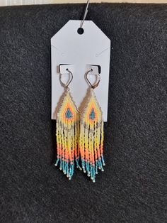 Original design, handwoven with Miyuki Delica beads. Feather light. On silver colored leverback ear hoops. Approx 3.5 inch dangle Festival Teardrop Beaded Fringe Jewelry, Festival Jewelry With Beaded Fringe, Bohemian Teardrop Beaded Fringe Jewelry, Handmade Yellow Bohemian Teardrop Earrings, Multicolor Handwoven Teardrop Earrings, Handwoven Multicolor Teardrop Earrings, Beaded Dangle Teardrop Earrings For Festivals, Handwoven Teardrop Earrings For Festivals, Handwoven Multicolor Beaded Teardrop Earrings