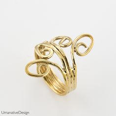 Trendy, beautiful, boho-chic toe ring / pinky ring / knuckle ring (knuckle rings are also called midi-ring or an above the knuckle ring). This is an open ring, so it is adjustable. Material: Brass One size fits all. Width: 0.8Inch / 20mm (widest part),0.158Inch / 4 mm around. *Nickel- free For more toe & knuckle rings- https://www.etsy.com/shop/Umanativedesign?section_id=17028060&ref=shopsection_leftnav_7 We offer a range of septum rings, for pierced and non- pierced noses, made of diffe Gold Bohemian Stackable Toe Rings, Unique Handmade Gold Stackable Rings, Handmade Yellow Gold Open Midi Rings, Handmade Gold Stackable Rings, Bohemian Gold Stackable Open Rings, Bohemian Gold Toe Ring, Bohemian Style Gold Stackable Open Rings, Handmade Gold Toe Ring, Elegant Adjustable Handmade Toe Rings