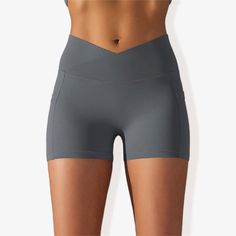 The Anna-Kaci Women's V-Cross Front Wide Band Biker Shorts are a stylish and functional addition to your activewear collection. These yoga shorts feature a unique V-cross front wide band for a secure and flattering fit. Made with 4-way stretch fabric, they offer maximum flexibility and comfort during any activity. The side pocket detail provides practical storage for essentials, while the side panel design adds a trendy touch. Perfect for yoga, workouts, or casual wear, these biker shorts combin Versatile Activewear With Built-in Shorts For Outdoor, Versatile Activewear With Built-in Shorts For Outdoor Activities, Functional Yoga Pants With Built-in Shorts For Sports, Casual Sports Bottoms With Crossover Waistband, Fitted Activewear With Built-in Shorts And Crossover Waistband, Fitted Activewear With Built-in Shorts For Outdoor Activities, Short Activewear For Outdoor Activities, Stretch Biker Shorts With Pockets For Yoga, Short Solid Activewear For Outdoor Activities