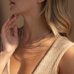 Our Herringbone Duo Chain Necklace is a showstopper that transforms any outfit in a statement ensemble. The bold Herringbone chain combined with the more dainty Box chain add dimension and interested, allowing for the necklace to be unique and minimalist at the same time. Finish/Material: 18K Gold Over Brass ∙ Rhodium Over Brass Featuring a layered necklace set with a ~3mm Herringbone Chain at 16 inches and a ~1mm Box Chain at 18 inches, adjustable with a 2 inch extension Part of the Golden Godd Trendy Layered Snake Chain Necklace, Minimalist Snake Chain Layered Necklace, Minimalist Multi-strand Clavicle Chain Necklace, Trendy Snake Chain Clavicle Necklace, Minimalist Metal Layered Necklace For Everyday, Minimalist Everyday Metal Layered Necklace, Everyday Minimalist Metal Layered Necklace, Trendy Herringbone Necklace For Everyday, Minimalist Double Chain Herringbone Necklace For Everyday