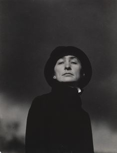 black and white photograph of a woman wearing a hat