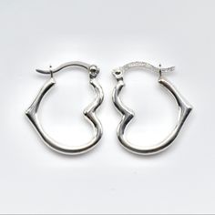 Beautiful Pair Of Heart Shaped Hoop Earrings. They Are 14k White Gold, Stamped On The Posts. The Earrings Measure 15mm Long Or 5/8ths Of An Inch. They Weigh .45 Grams. Brand New, Great Gift! Nickel-free White Gold Sterling Silver Huggie Earrings, Silver Double Heart Classic Earrings, Silver Classic Double Heart Earrings, Silver Nickel-free Hoop Earrings For Valentine's Day, Heart-shaped Pierced Hoop Earrings For Anniversary, Small Hoop Earrings With Heart Charm For Anniversary, Anniversary Small Hoop Earrings With Heart Charm, Classic Sterling Silver Heart Earrings For Everyday, Sterling Silver Pierced Huggie Earrings For Anniversary