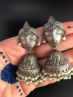 Extremely original, silver-colored metal earrings.A face of an Indian God Krishna with earwires - There are also earrings carved half-neck decorated with pearls The earrings are very light. Measurements Length 7 cm, width 3.5 cm. *Extremely Light weight. *Premium Quality. *Zinc Free *Allergic Free. *High Quality Metal. Wear can any outfit Handmade Silver Fusion Style Jhumkas, Handmade Silver Fusion Jhumkas, Silver Metal Fusion Jhumkas, Silver Fusion Style Drop Jhumkas, Silver Fusion Style Metal Jhumkas, Silver Metal Fusion Style Jhumkas, Heavy Silver Dangle Earrings, Silver Pearl Earrings For Celebration, Silver Fusion Pearl Drop Earrings