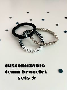 "These customizable sports team bracelets will lend a unique touch to any outfit and let everyone know who you are rooting for this year. With a sense of style and luck for any game, match, or competition, you won't regret purchasing! Examples/Instructions: For the team bracelet, (the one with the letters), you can type your order of colors and the name of the team you want on the bracelet.  Example: Colors 1,2,3,1,2,3, etc. \"Eagles\" For primary color bracelet, (the one with a main color and 3 Team-colored Sports Bracelets With Letter Beads, Team-colored Bracelets With Letter Beads For Sports, Team-colored Letter Beads Bracelets For Sports, Adjustable Team-colored Beaded Bracelets, Team Spirit Letter Beads Wristband For Game Day, Team Spirit Wristband With Letter Beads For Game Day, Team-colored Wristband For Game Day, Sporty Beaded Bracelets In Team Colors For Sports Events, Sporty Team-colored Beaded Bracelets For Sports Events