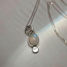 ✺ This sweet and celestial moonstone has been set in silver. Hanging from a sparkly 20-inch sterling silver curb chain necklace. ✺ M A T E R I A L S : * 20-inch sterling silver chain + clasp * sterling silver * moonstone A B O U T * T H I S * N E C K L A C E : This .925 sterling silver, copper + brass necklace was carefully designed with intention and creative motive. It should last you years to come with occasional polishing and delicate care. It is suggested to remove sterling silver jewelry b Celestial Silver Moonstone Necklace, Silver Moonstone Necklace With Symbolic Style, Artisan Adjustable Moonstone Necklace, Mystical Silver Moonstone Necklace, Soldered Moonstone Pendant Necklace, Minimalistic Necklace, Ethereal Jewelry, Earthy Jewelry, Brass Necklace