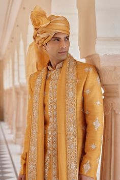 Orange peel raw silk sherwani with zardosi, french knots and aari embroidery. Comes with churidar, a kurta and a dupatta. - Aza Fashions Festive Bandhgala With Zari Work In Traditional Fit, Festive Bandhgala With Zari Work, Traditional Fit Bandhgala For Eid, Eid Traditional Bandhgala, Traditional Bandhgala With Chikankari Embroidery In Art Silk, Traditional Fit Sherwani With Zari Work For Eid, Traditional Fit Sherwani With Resham Embroidery For Festivals, Traditional Fit Sherwani With Intricate Embroidery For Diwali, Eid Sherwani With Zari Work In Traditional Fit