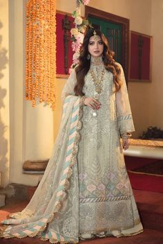 100% Original Brand New Gisele Sajni Wedding Collection - Jasmine 4 Piece Embroidered Suit Description Jasmine is an ivory dress with eye-catching designs created from carefully placed sequin embellishments. The embroidered dupatta gives it an added bit of grace, creating a wonderful sense of completeness to the entire dress. Fabric Details Front Sequins Embroidered Center Panel on Organza Sequins Embroidered Left Panel on Organza Sequins Embroidered Right Panel on Organza Back and Sleeves Sequins Embroidered Center Panel for Back on Organza Sequins Embroidered Right Panel for Back on Organza Sequins Embroidered Left Panel for Back on Organza Sequins Embroidered Sleeves on Organza Dupatta Sequins Embroidered Dupatta on Organza Extensions Embroidered border for front and back on Organza Emb Beige Georgette Traditional Wear For Reception, Cream Semi-stitched Gown For Eid, Unstitched Ceremony Set With Dupatta, Semi-stitched Floor-length Wedding Dress For Ceremony, Embroidered Floor-length Wedding Dress For Eid, Festive Wedding Dress With Resham Embroidery For Eid, Semi-stitched Sharara With Dupatta For Ceremony, Semi-stitched Sharara For Eid Ceremony, Anarkali Wedding Dress With Resham Embroidery For Party