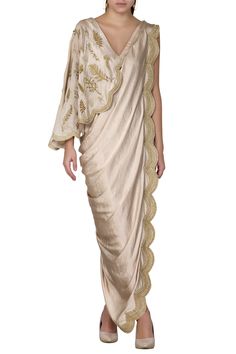 Gold saree dress with placement leaf work and scallop border.
Components:1
Bead and sequin embroidery
Neckline:V-shaped neckline
Sleeve Length:Sleeveless
Fabric:Satin
Color:Gold
One shoulder  drape
Deep v-shaped back - Aza Fashions Draped Saree Gown, Gowns Gold, Panelled Dress, Saree Gowns, Drape Sarees, Gown For Women, Draping Fashion, Saree Gown, Drape Saree