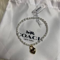 Glass Pearls Plated Brass And Cubic Zirconia Stretch Diameter - 2 1/2 (L) Style No. Ci891 Sold Out Online Authentic New With Tags And Dust Bag Coach Bracelets, Pearl Bracelet Gold, Pretty Shoes Sneakers, Ankle Jewelry, Coach Jewelry, Bracelet Pearl, Heart Lock, Coach New York, Pretty Shoes