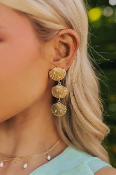 Go for a stylish beachy vibe with these chic earrings! - Gold colored material with faux pearl accents - A seashell stud with dangling seashells design - Post and backs - Length: 2.6 inches Beach Earrings, Chic Earrings, Fairytale Dress, Jean Accessories, Holiday Trends, Shell Earrings, Lace Fashion, Earrings Gold, Earring Necklace