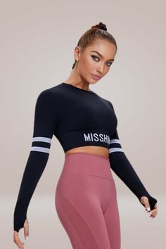 Embrace both fashion and fitness with our Athleisure Long Sleeve Black Crop Top. Its snug fit and contrasting waist band bring a touch of sporty chic to your wardrobe. This cute crop top can be worn for any workout or casual outing, with its long sleeves and crop cut adding a stylish touch. Wear it with high-waisted leggings for a gym-ready look or with jeans for a trendy, off-duty outfit. Try it now and elevate your athleisure game! Moisture-Wicking: Quick-dry technology for an always fresh feel. Athletic Long Sleeves with Thumb Holes: Provides extra coverage and ensures sleeves stay in place during active use. Breathable Fabric: Keeps you comfortable and dry throughout your workout. Cropped Cut: Fashionably ends above the waist for a contemporary silhouette. Low Maintenance: Simple machi Long Sleeve Black Crop Top, Off Duty Outfits, Black Long Sleeve Crop Top, Cute Crop Top, Party Kleidung, Black Crop Top, Cute Crop Tops, Sporty Chic, Thumb Holes