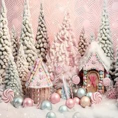 a pink and white christmas scene with candy trees