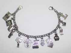 "This listing is for 1 Stainless Steel Nickle Free Cable Chain Charm bracelet, Nickle free zinc alloy charms. *This bracelet measures approx 8 \" in length. You have the option to choose other bracelets sizes and also to add an initial charm Please select the charms that you would like on your bracelet from the photo chart shown in this listing and then send me a list with the corresponding number of each charm. Maximum limit of 11 charms When purchasing a bracelet for someone other than yoursel Nickel Free Novelty Bracelet Jewelry, Adjustable Silver Novelty Jewelry, Novelty Charms Bracelet Jewelry, Novelty Jewelry Charms Bracelet, Silver Novelty Jewelry With Lobster Clasp, Novelty Silver Hypoallergenic Bracelets, Silver Novelty Charm Bracelet As A Gift, Silver Novelty Charm Bracelet Gift, Novelty Silver Charm Bracelet Gift