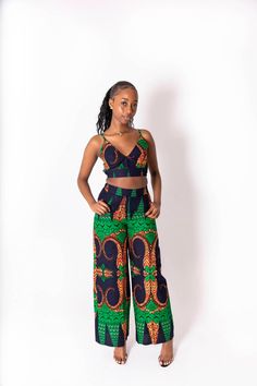 This Kimmy African print co-ord is the perfect fit for the summer. Made from 100%cotton fabric and stitched to excellent quality.  Why not pair it up with some tan summer sandals for the perfect day look. Alternatively white sandal heels for a chic evening look. Features: - 100% cotton fabric  - wax cotton print  - elasticated waist  - matching top included  Model 1 wears size 8 UK Model 2 wears size 18 UK Care Instructions: Handwash or dryclean only  Do not bleach Hang to dry Multicolor Two-piece Pant Set For Summer, Summer Cotton Sets With Long Pants, Cotton Long Pants Set For Summer, Casual Matching Set With Wide Leg, Casual Wide Leg Matching Set, Cotton Printed Pants For Vacation, Casual Patterned Cotton Sets, Green Printed Sleeveless Set, Sleeveless Green Printed Sets